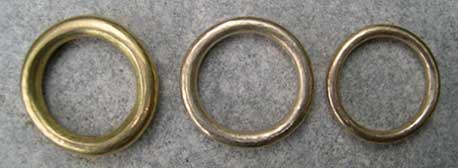 three sizes of yellow gold wedding rings