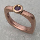 contemporary amethyst and red gold ring