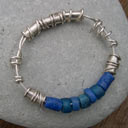 designer silver and blue glass expanding bangle with handmade beads