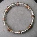 designer silver and gold bangle with handmade beads