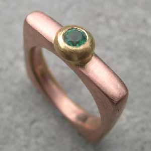 Emerald Engagement Ring  in red gold with a yellow gold setting