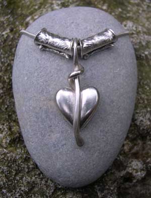 Silver heart pendant with textured silver beads
