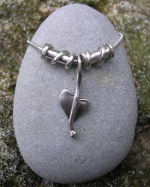 Silver heart pendant with twist beads