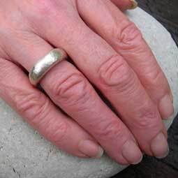 handmade pebble ring being worn