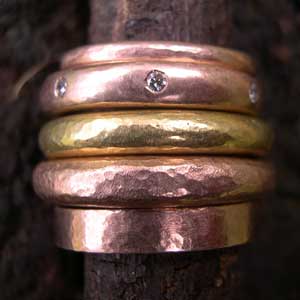 Stack of red and yellow gold wedding rings