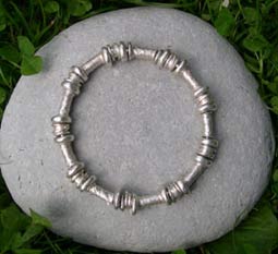 designer silver bangle with handmade beads