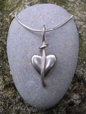 Heart pendant on silver snake chain