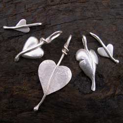 five silver heart pendants