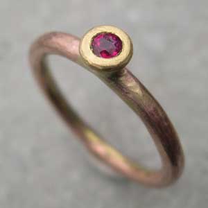 Ruby Engagement Ring  set in yellow gold on a red gold shank