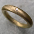 single diamond handmade eternity ring in 18ct yellow gold