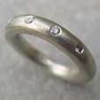 White gold eternity ring with 4 diamonds
