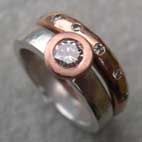 Diamond engagement band witha red gold diamond eternity ring