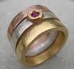 designer gold silver and ruby wedding ring stack