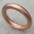 Chunky red gold wedding ring lightly hammered and hand brushed