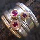 stack of 3 ruby rings with two diamond eternity rings