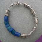 expanding bangle with blue glass and silver beads