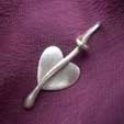 a silver heart leaf pendant