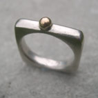 silver square ring with gold pillow