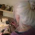 Sue Yeoman making  silver rings in the workshop